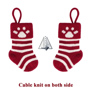 Detail showing cable knit pattern on both sides of festive pet Christmas stockings