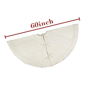 Detailed close-up of 60-inch cream cable knit Christmas tree skirt with ribbon ties