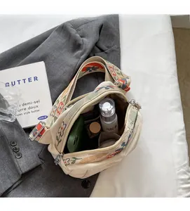 Internal view of cream oxford shell bag showing spacious storage for daily essentials