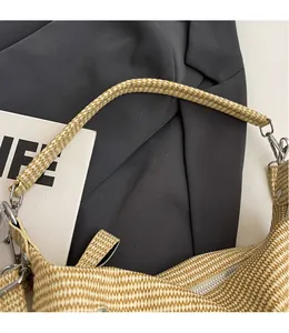 Close-up of the fine woven texture and silver metal zipper on a beige tote bag