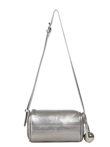 Minimalist silver cylindrical crossbody bag with metallic leather and sphere pendant charm