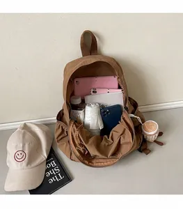 Top view of spacious interior of brown nylon backpack showing large capacity storage
