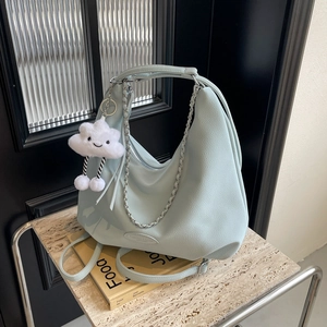 Minimalist mint green leather hobo bag with silver chain and white cloud charm
