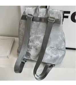 Detail view of the silver gray PU leather backpack with smooth adjustable shoulder straps