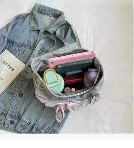 Top view of grey velvet backpack interior showing large capacity for tablet and bottle