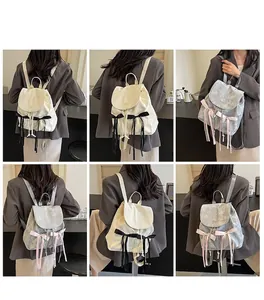 Model lifestyle shots of mini bow backpacks in cream and silver-grey stylish finishes
