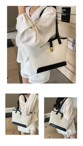 Detail of minimalist tote bag featuring textured lychee grain and golden twist lock closure