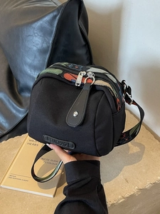 Black oxford canvas crossbody shell bag with colorful floral embroidery straps