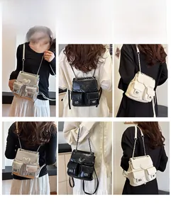 Mini heart-shaped leather backpack with chain straps in silver, black, and beige