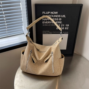 Large beige woven shoulder bag with silver zippers and hobo style for summer