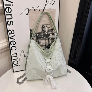 Pale green marble pattern shoulder bag with lace bow detail and metallic chain