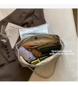 Interior view showing the large capacity and functional compartments of the silver bag