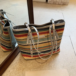 Colorful striped woven straw tote bag with silver eyelet metal shoulder straps