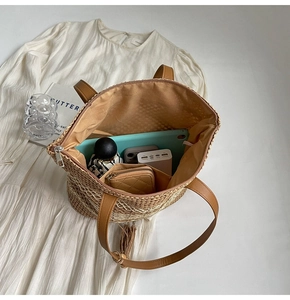 Spacious woven tote bag with leather handles and interior view of daily essentials