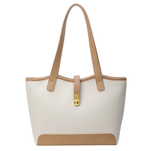 Cream-white large canvas tote bag with brown straps and golden metal rotary lock