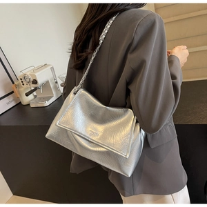 Close-up of metallic silver pleated shoulder bag with WESOOO branding and chain strap
