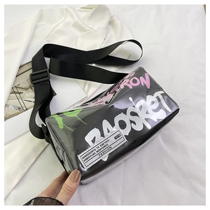 Detail of transparent PVC crossbody bag with graffiti text and adjustable wide strap