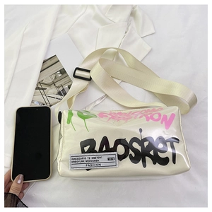 Top view of white graffiti jelly crossbody bag with thick strap on silk fabric