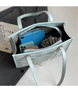 Top view of large capacity striped tote bag interior with tablet and phone compartments