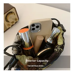 Internal capacity of retro oil painting bucket bag with phone and cosmetics