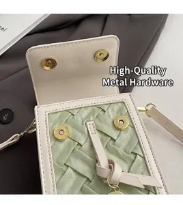 Detail of elegant cream leather phone bag featuring green woven texture and gold magnetic buckles