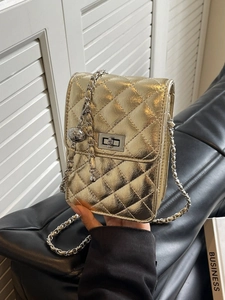 Metallic gold quilted mini crossbody bag with leather-threaded chain and twist lock