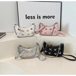 Collection of hobo bags with butterfly charms in white, pink, silver, and black colors