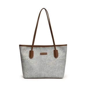 Minimalist grey large capacity tote bag with brown leather handles for women's daily commute