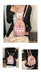 Detail view of pink checkered mini backpack with golden zippers and adjustable straps