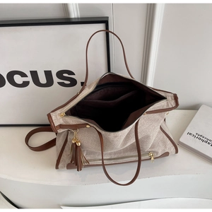 Top view of large canvas tote bag showing interior compartments and secure zipper closure