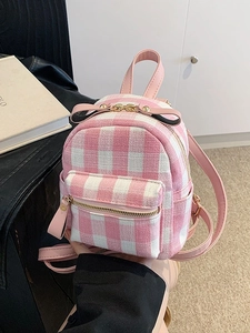 Pink and white checkered small backpack with a contrast bow and golden hardware