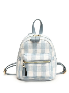 Mini backpack in blue and white plaid pattern with light blue leather straps and gold hardware
