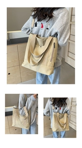 Detail of canvas tote bag with metal snap pocket, side zipper and adjustable strap
