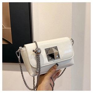 Detail of silver pyramid lock and crocodile embossed white leather small square bag