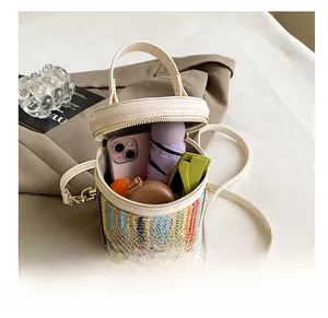 Detail shot of woven bucket bag interior showing capacity for phone, umbrella and sunglasses