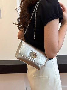 Silver metallic square crossbody bag with chain strap and geometric pyramid lock