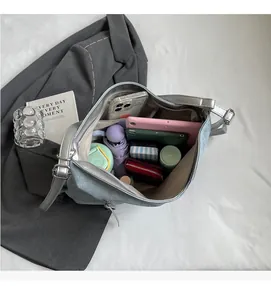 Spacious interior of light blue tote bag showing daily essentials and large capacity