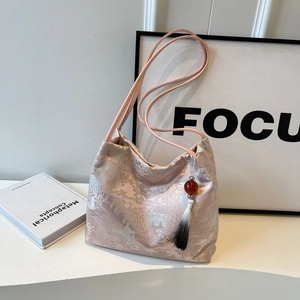 Pink satin tote bag with traditional Chinese landscape embroidery and elegant silk tassel