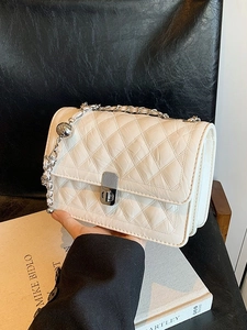 White quilted crossbody bag with silver chain strap and metal ball detail