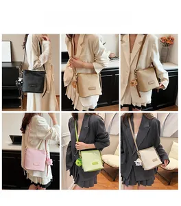 Vertical textured bucket bags with cute plush charms shown in multiple colors