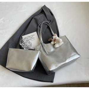 Silver metallic tote bag set with a plush bear charm and matching small pouch