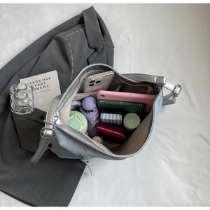 Top view of spacious light blue tote bag showing interior storage for tablets and wallets