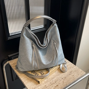 Vintage light blue denim tote bag with dual front zippers and silver handles for women