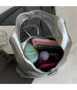 Internal view of silver pleated tote bag showing large capacity for essentials