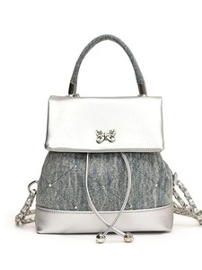 Mini sac à dos en denim matelassé et argent métallisé avec boucle papillon
