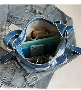 Internal view of blue checkered denim tote bag showing spacious compartments and zip pocket