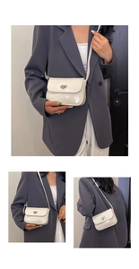 Detail of white patent leather handbag with a heart-shaped metal twist lock buckle