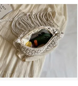 Internal view of bohemian straw crossbody bag showing spacious capacity and lining