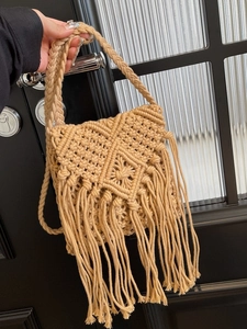 Bohemian hand-woven straw crossbody bag with khaki tassels for summer beach vacation