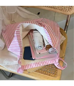 Top view of the pink striped canvas tote bag showing its spacious internal capacity
